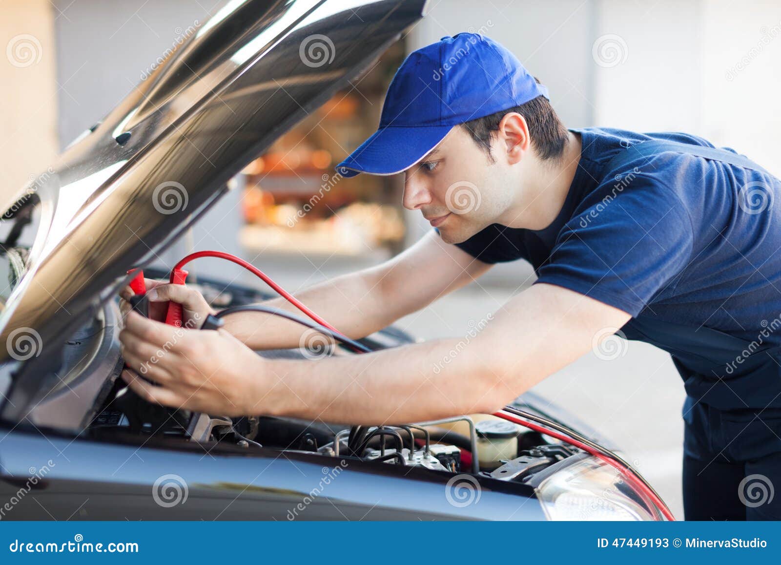 Mechanic Using Cables To Startup a Car Engine Stock Image Image of