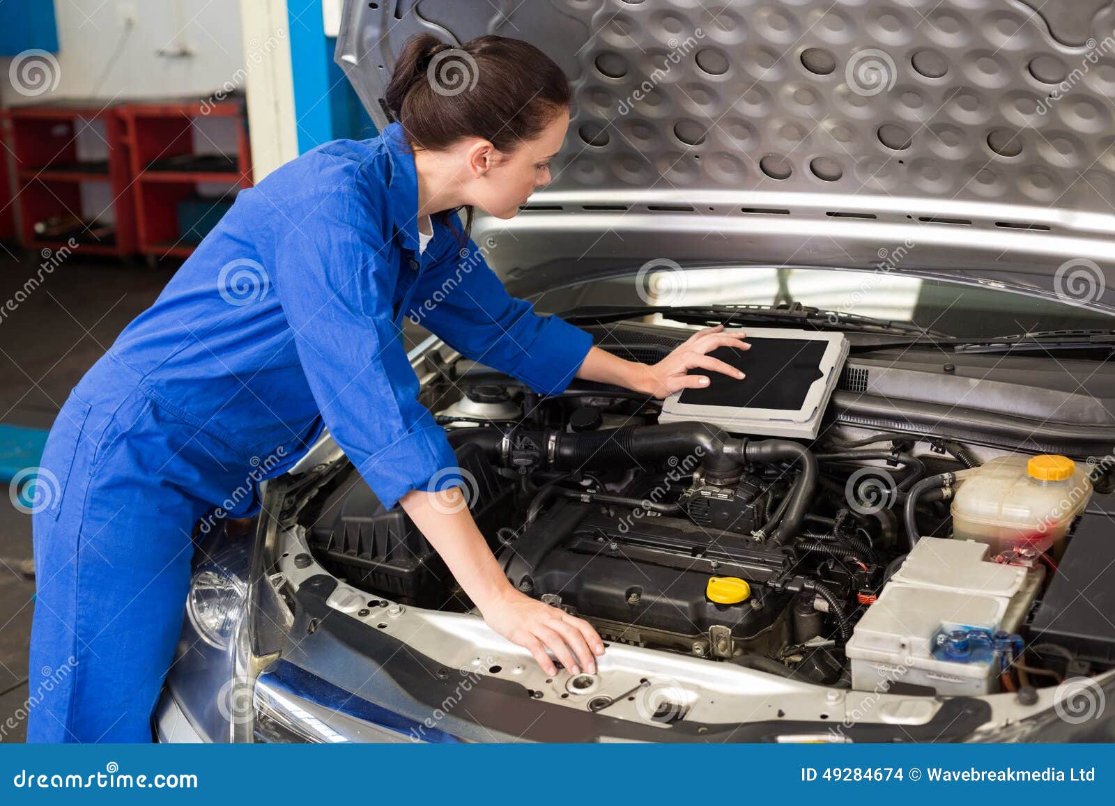 Mechanic Using Tablet To Fix Car Stock Photo Image of scrolling