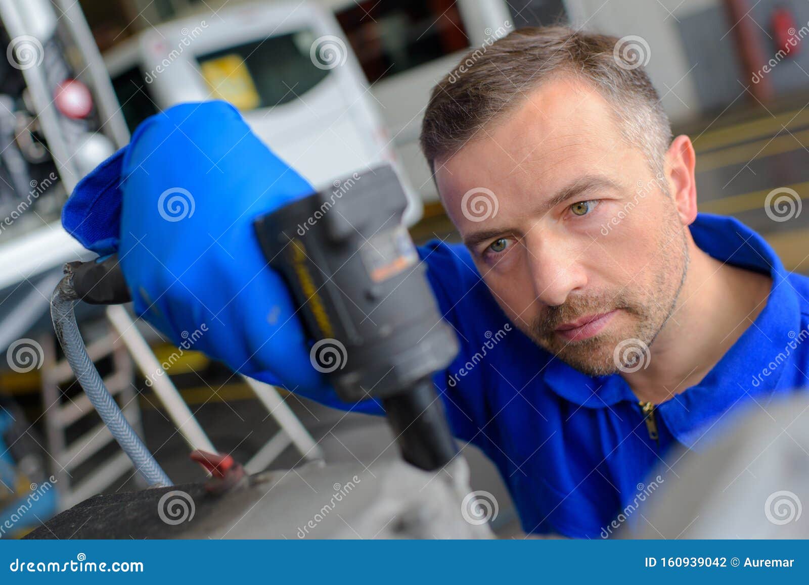 Mechanic using tool stock photo. Image of engineer, coach 160939042