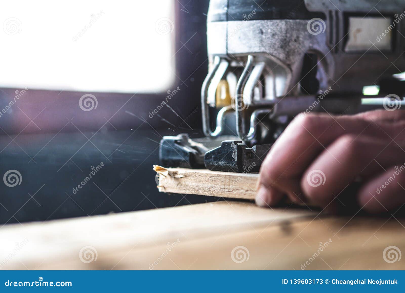 The Mechanic is Using Wood Cutting Tools in Construction Stock Image
