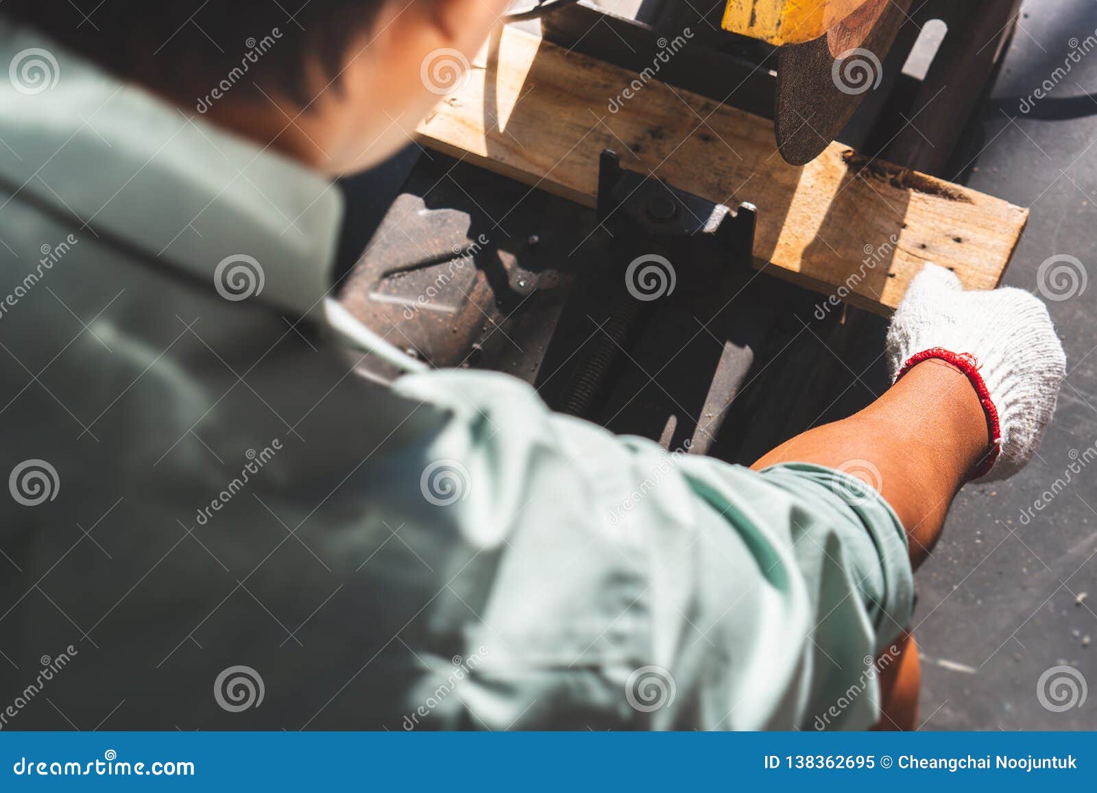 The Mechanic is Using Wood Cutting Tools in Construction Stock Image