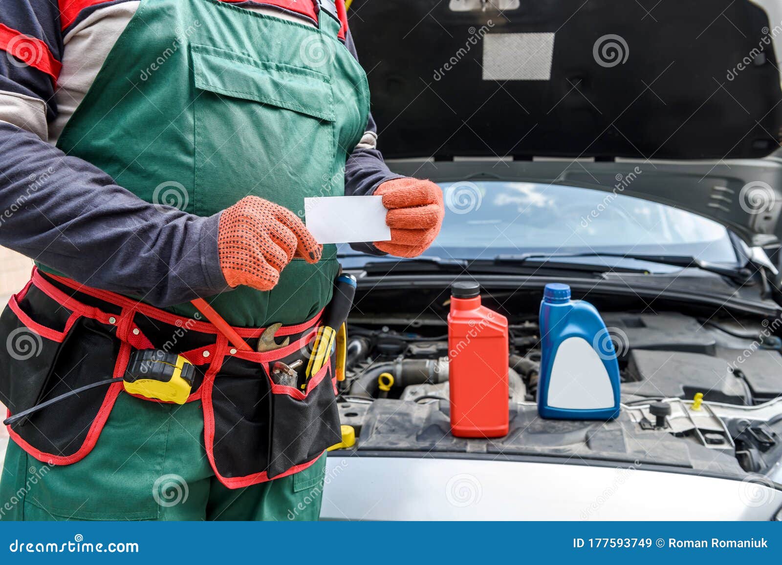 Mechanic With Visit Card Posing Near Car With Open Hood Stock Image