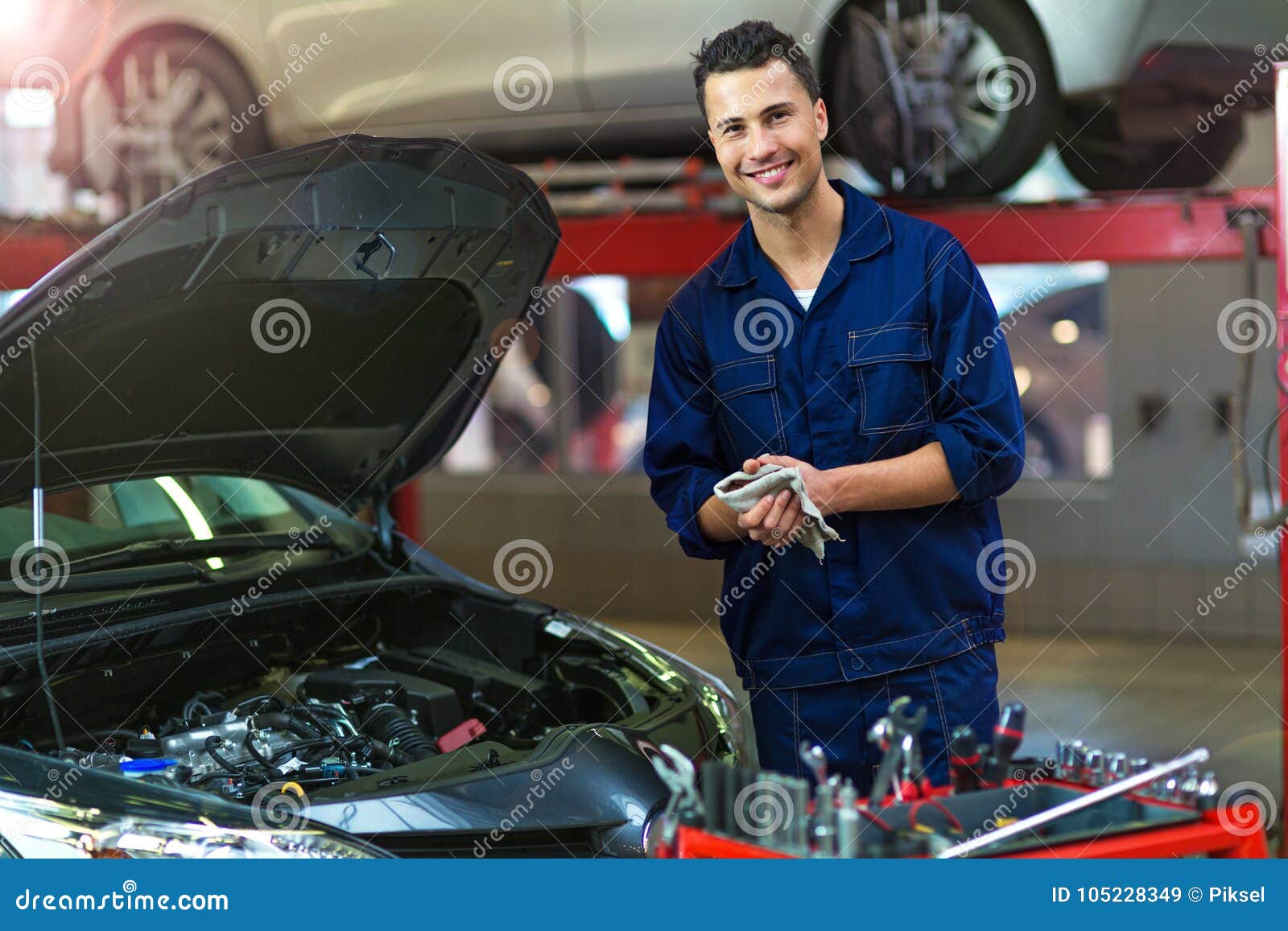 car mechanic in auto repair shop