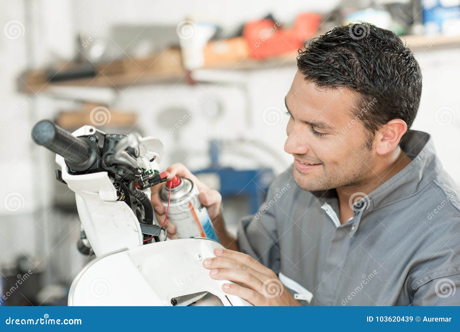 Mechanic Working on Scooter Stock Image Image of overalls