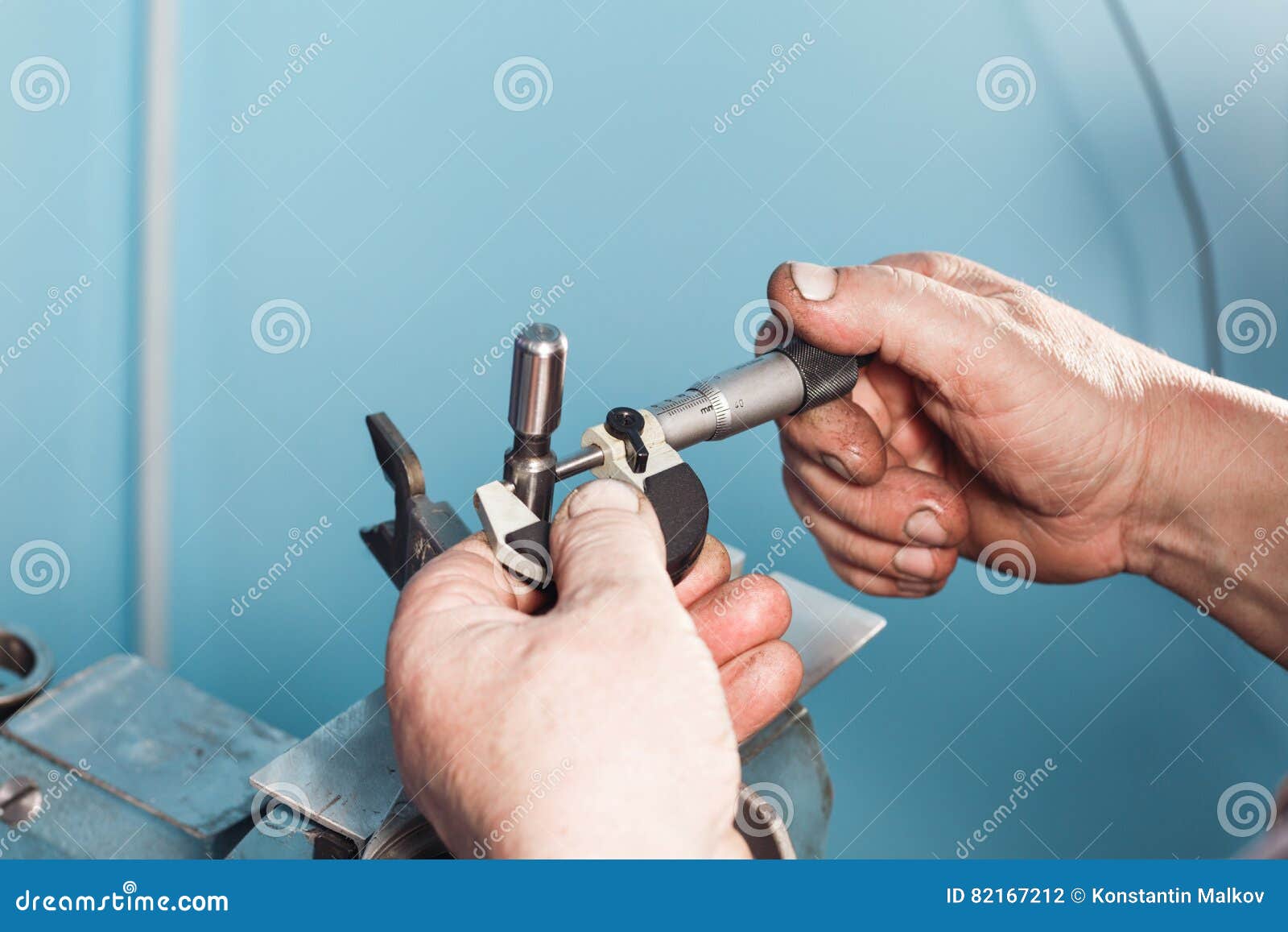 Mechanical Technician Worker Hands Measuring Detail Tool after