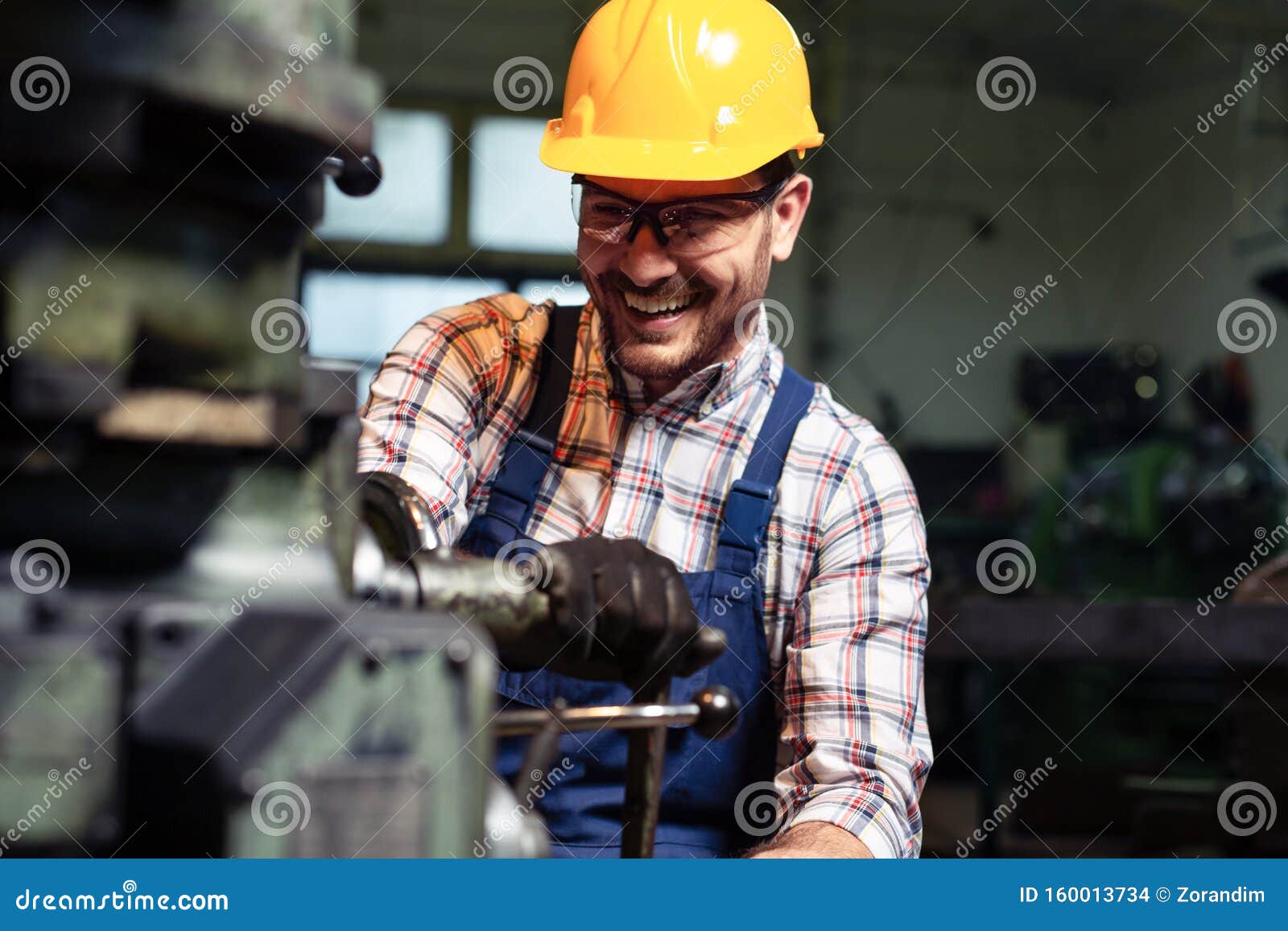 Mechanical Technician Working on Lathe Machine in Car Stock