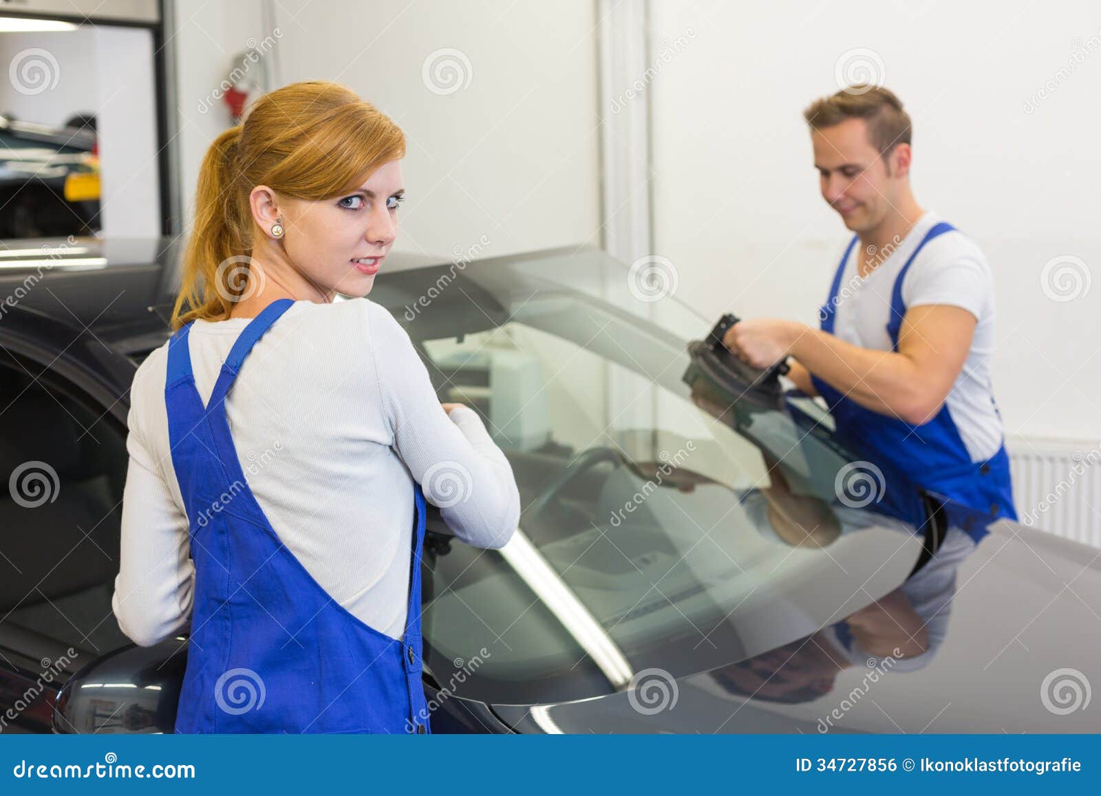 Mechanics or Glaziers Install Windshield or Windscreen on Car Stock