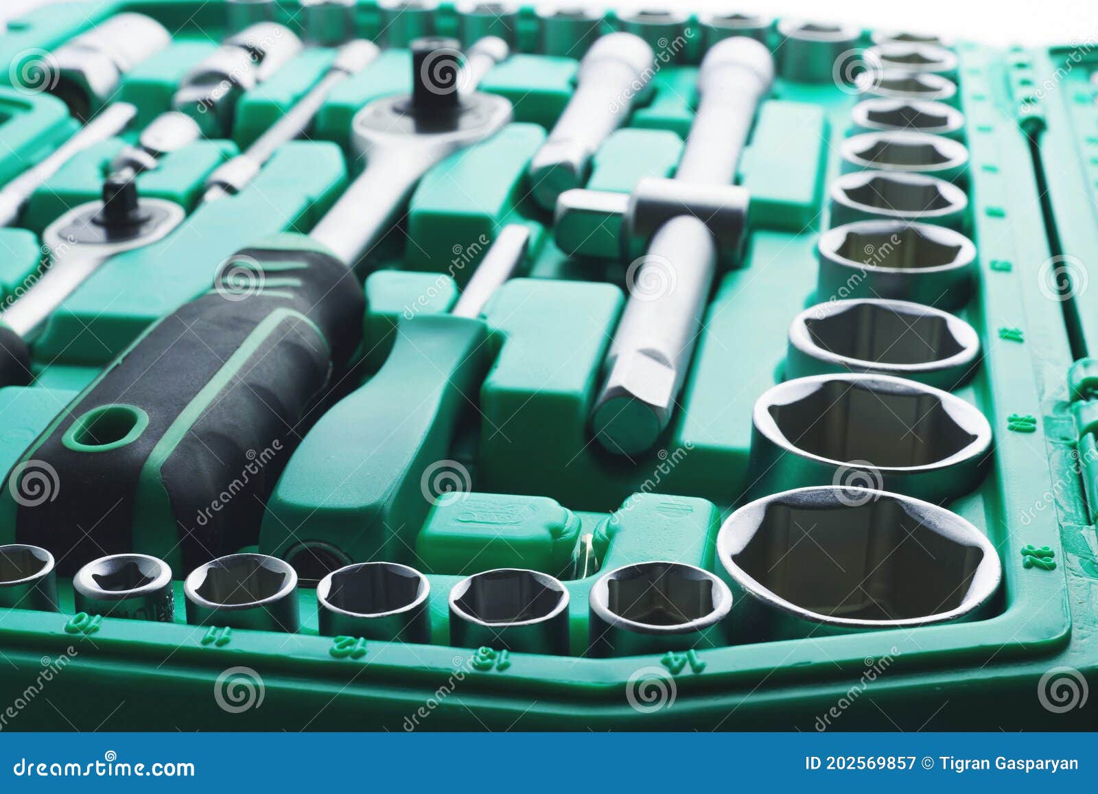 mechanics tool set and mechanic`s tool box close-up. plastic green storage box case. mechanics tool kit. tool box with tools