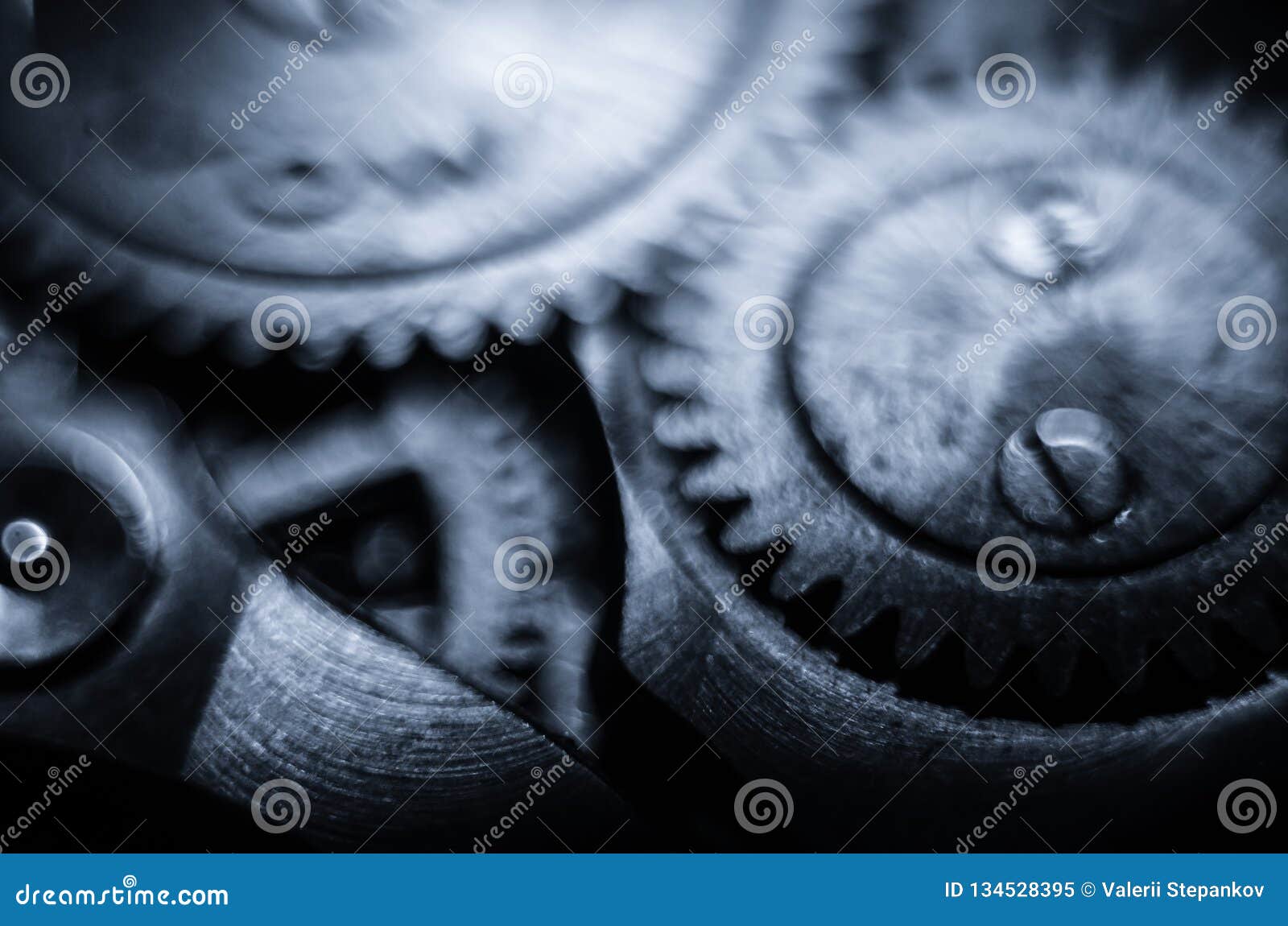 the mechanism of old antique pocket watches, close up view of old clock`s gears. selective focus