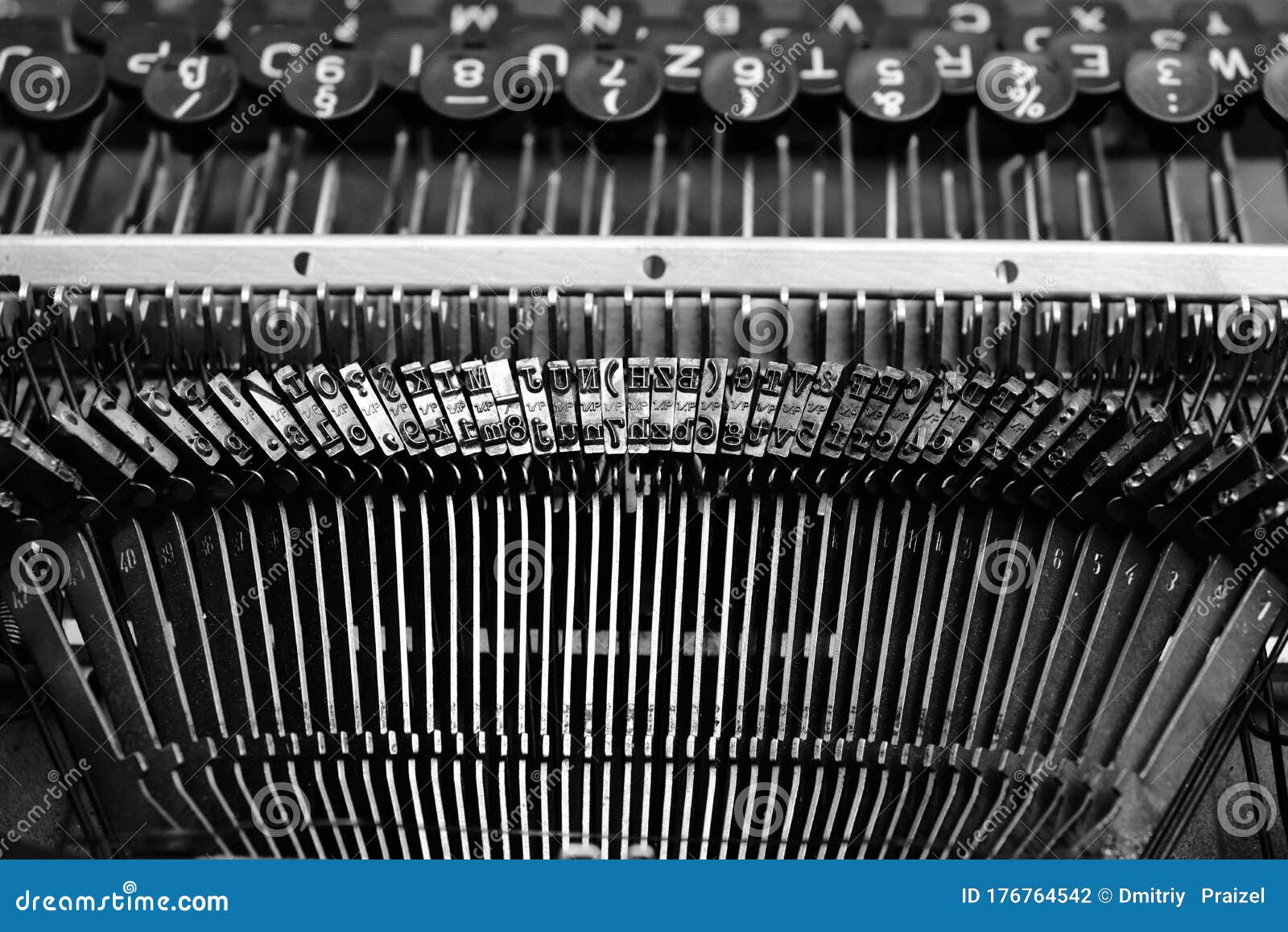 mechanism of typesetting strikers with the english alphabet in an old retro typewriter
