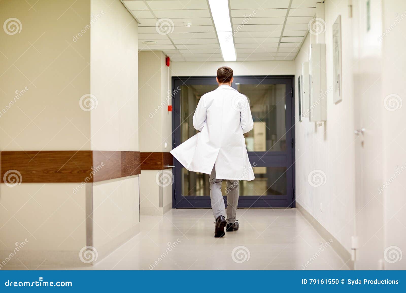 medic or doctor walking along hospital corridor