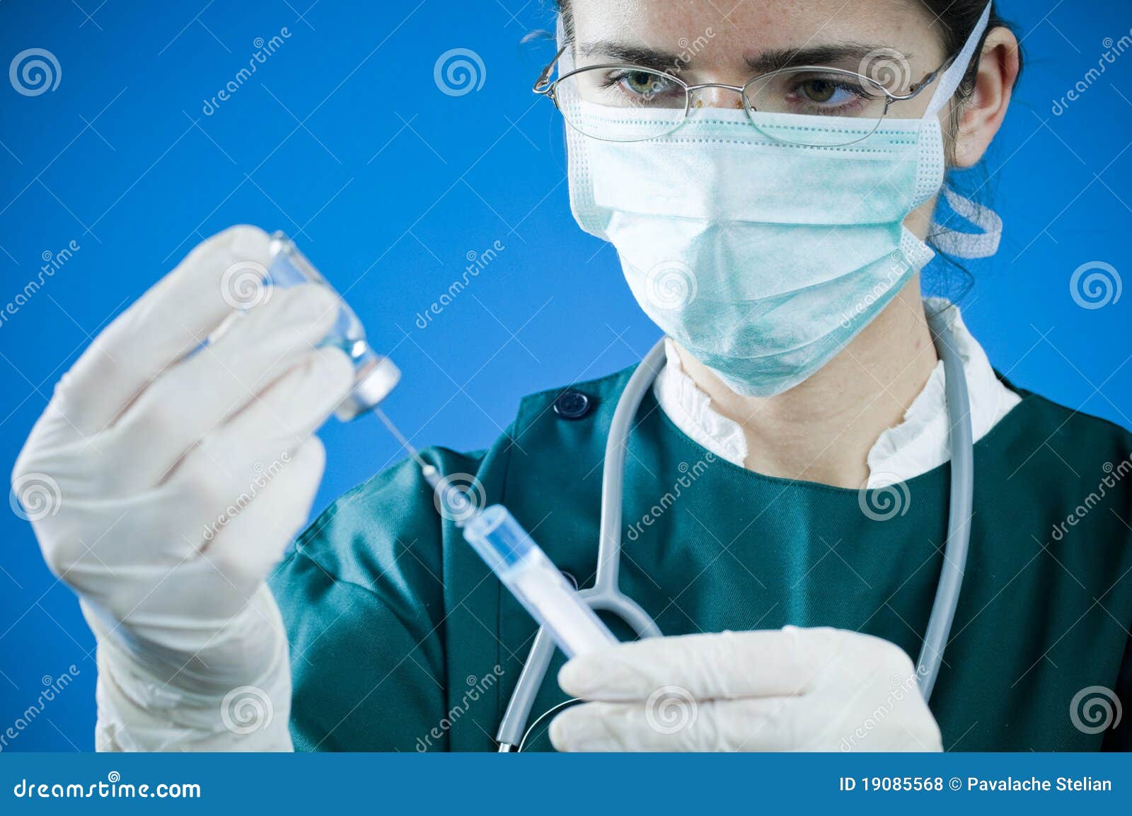 medic with syringe and medicine