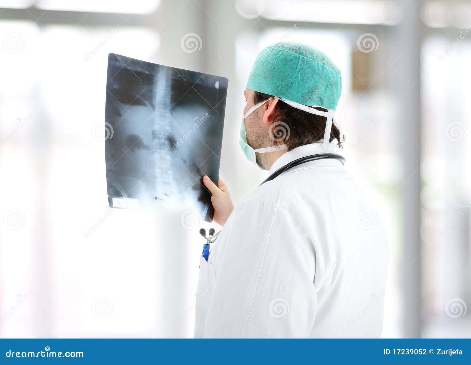 medical doctor analysing x-ray image handheld