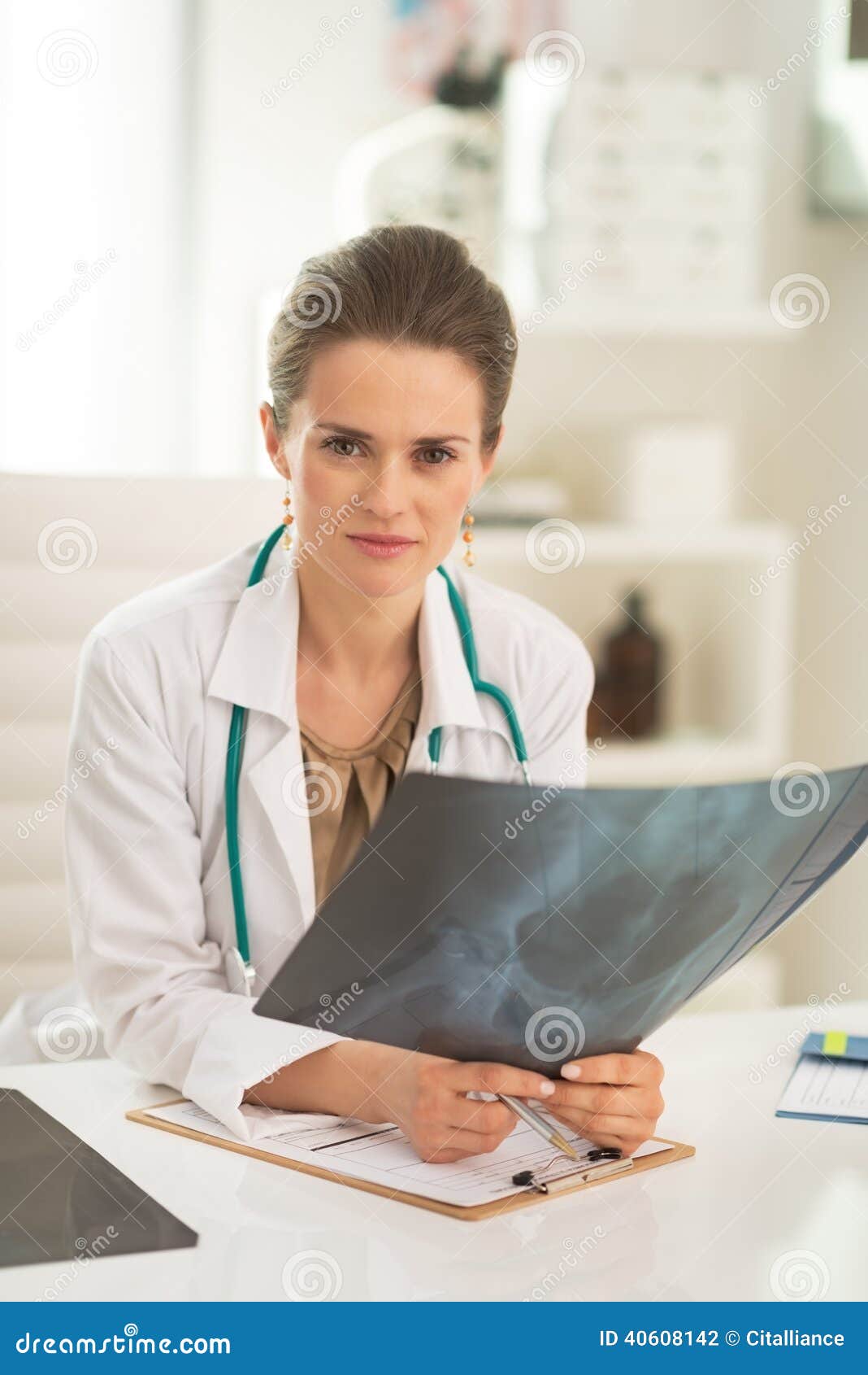 medical doctor woman with fluorography in office