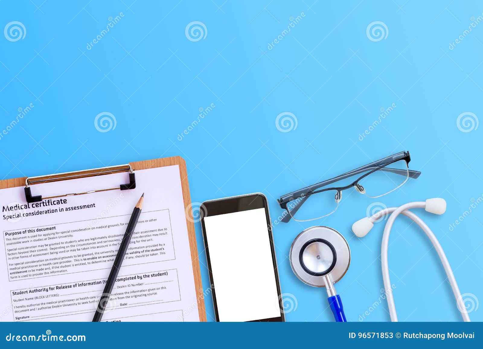 medical form with smart phone and blue stethoscop on wooden desk