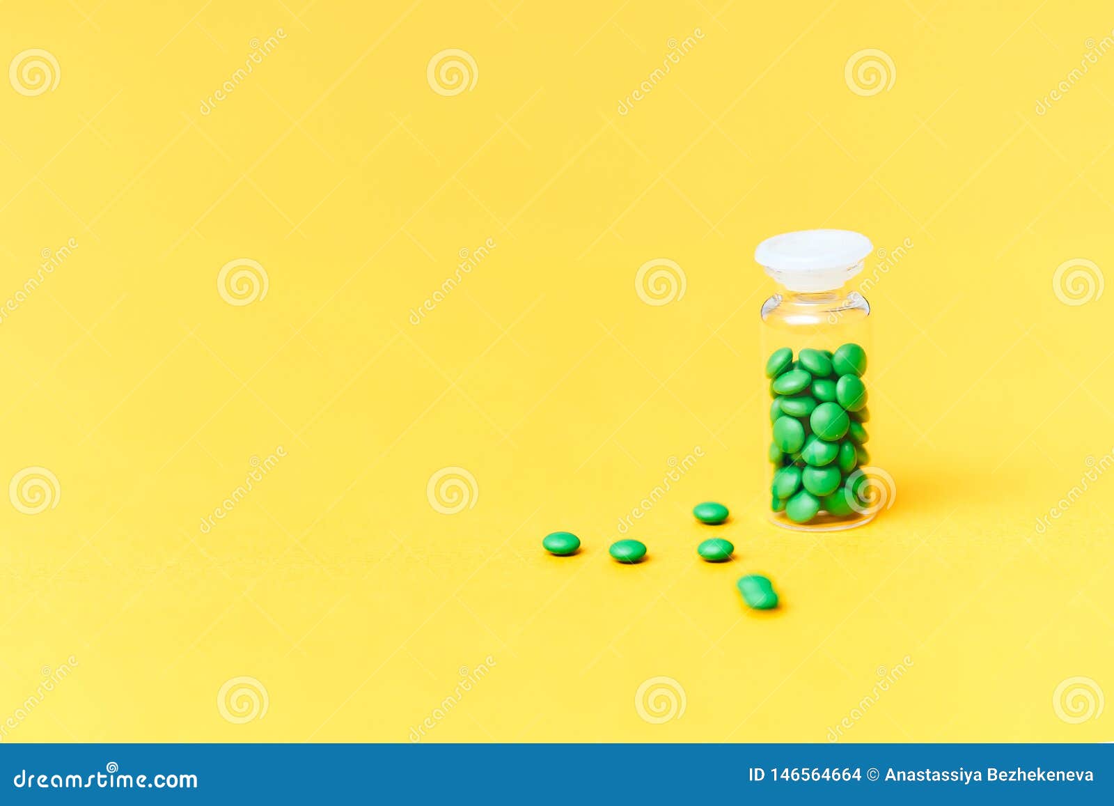 Download Medical Green Pills In A Glass Bottle On Yellow Background Copyspace Health Stock Photo Image Of Aspirin Medication 146564664 Yellowimages Mockups