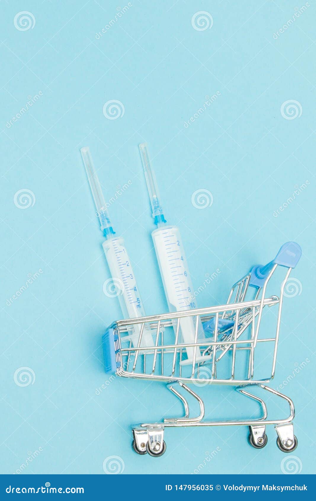 Medical Injection in Shopping Trolley on Blue Background. Creative Idea