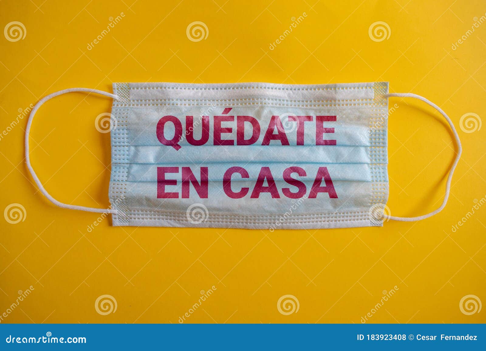 medical mask or cubrebocas with the phrase in spanish . quedate en casa.