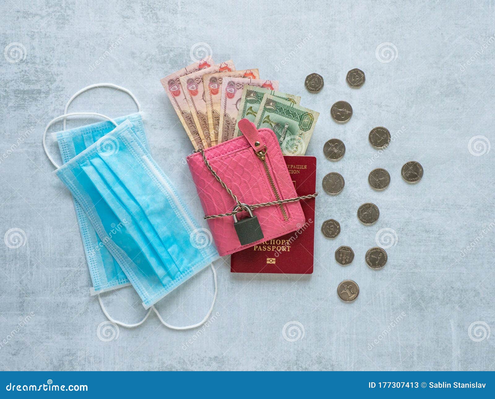 A Medical Mask, Pink Wallet, Arabic Dirhams, Chain And Lock. Pandemic And The Economic Crisis Of ...