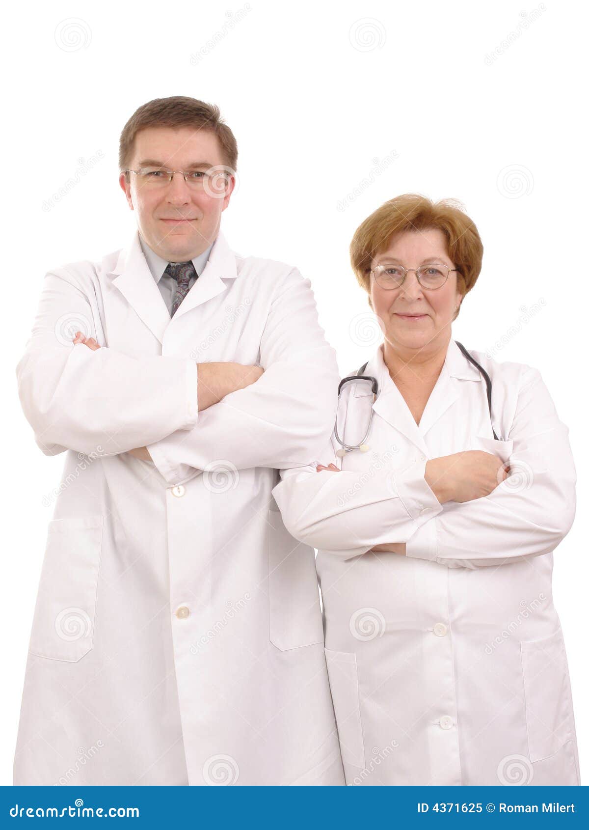 Medical staff. Young male and senior female doctors standing side by side over white background