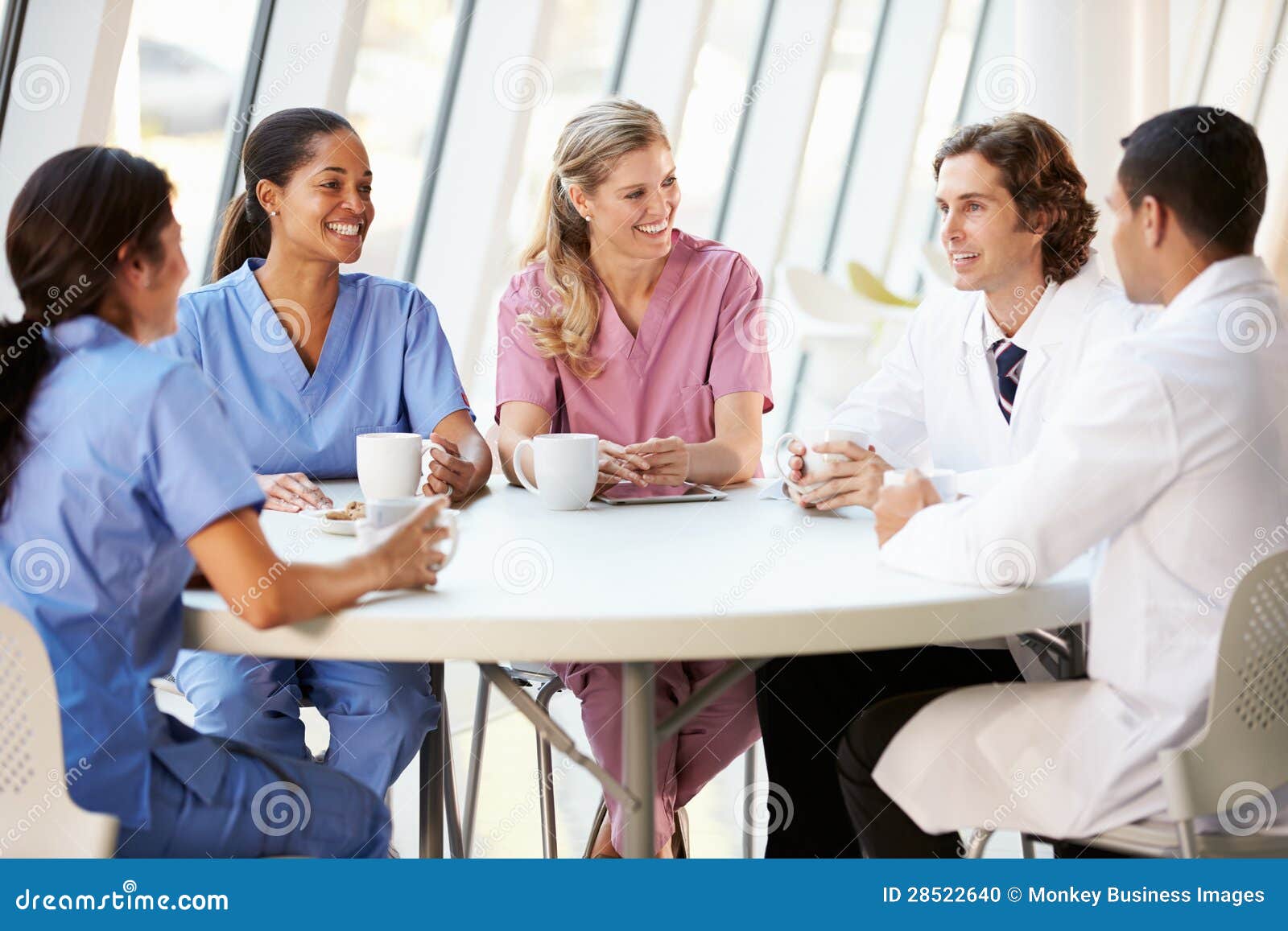 medical staff chatting in modern hospital canteen