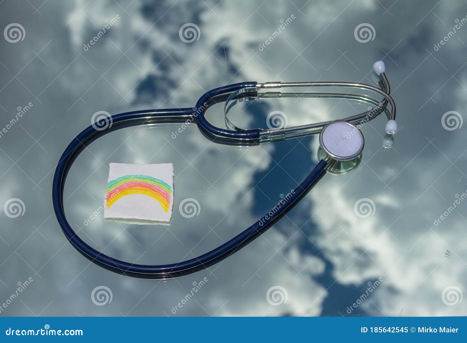 Medical Stethoscope with the Background of Clouds and Rainbow Drawn