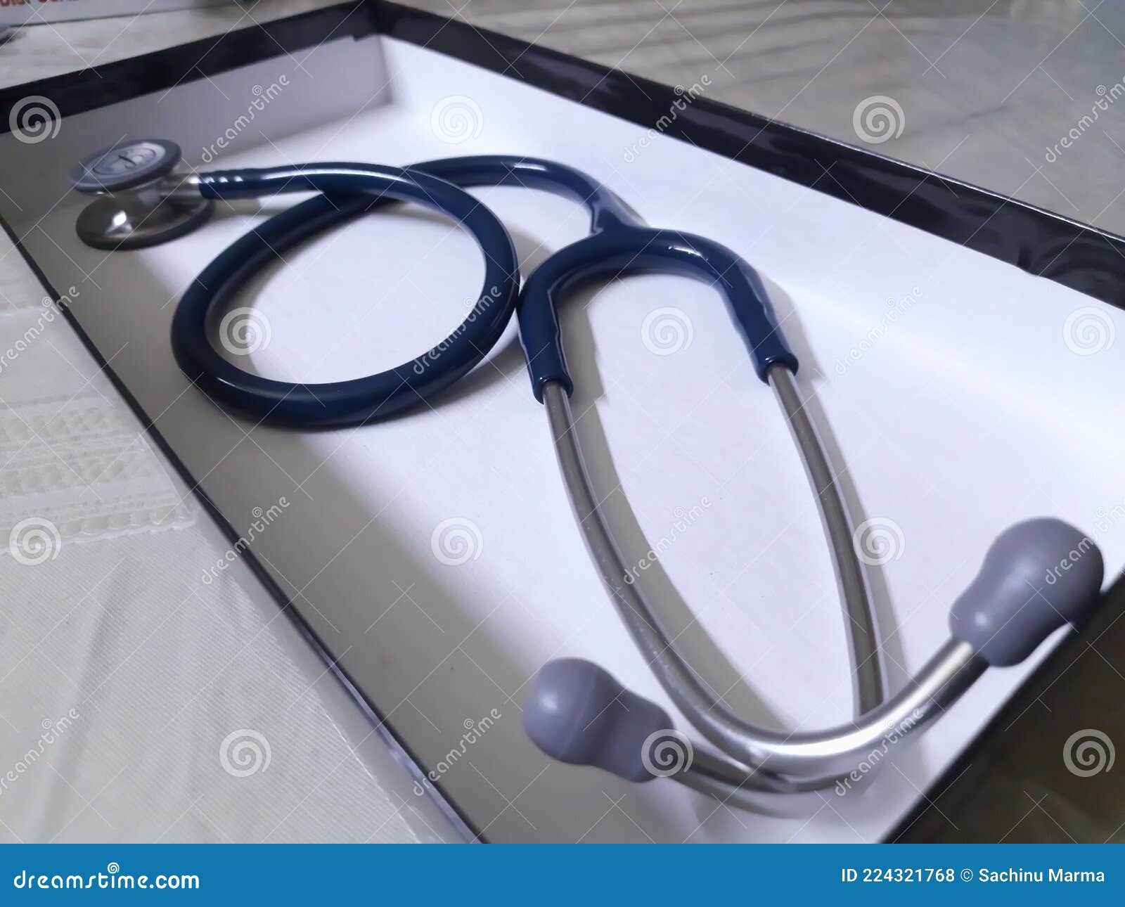 A Medical Stethoscope in a White Box on Table. Stock Photo Image of