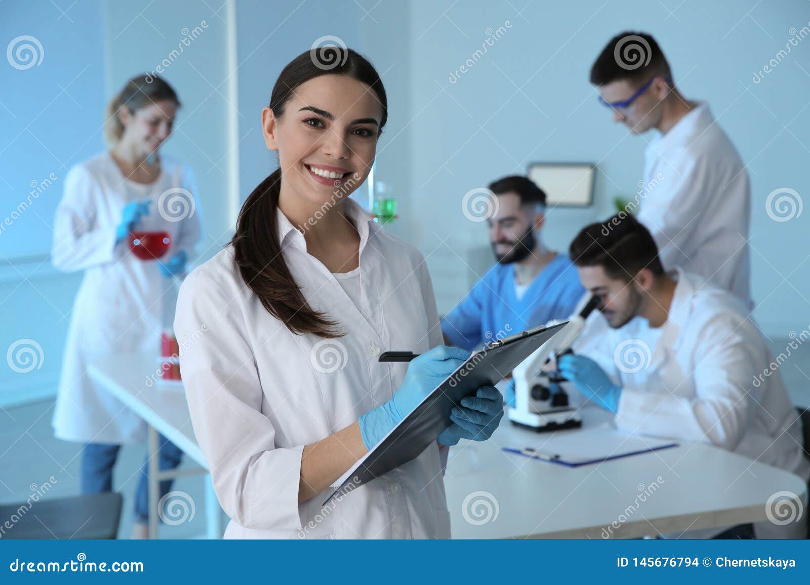 Medical Student with Clipboard in Modern Laboratory Stock Photo Image