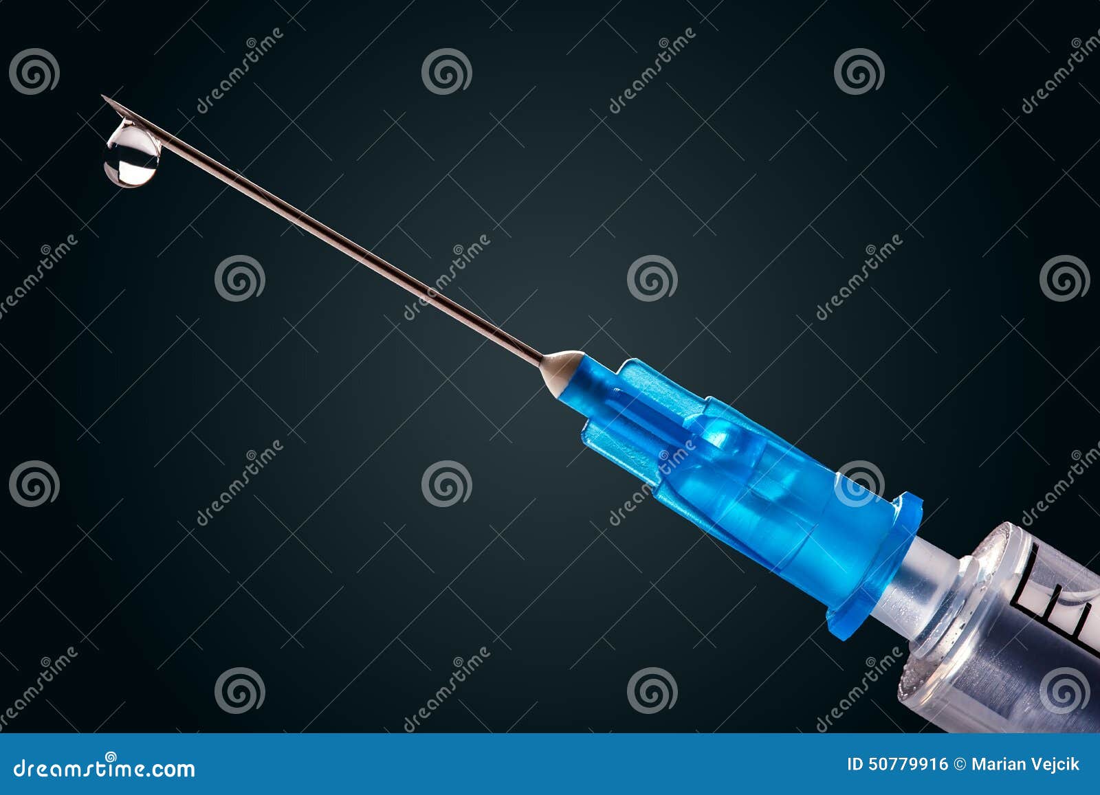 Medical Syringe with a Needle at the End of the Drop Stock Photo