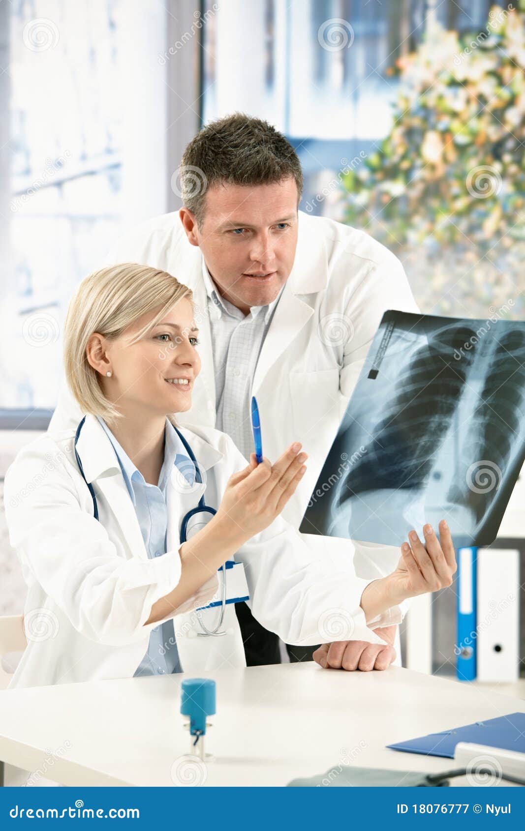 medical team discussing x-ray image