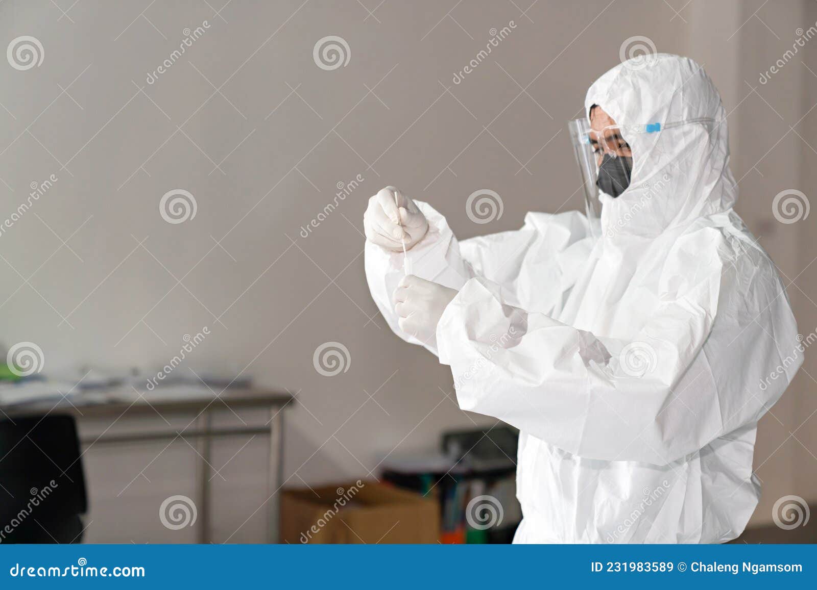 Medical Technologists Dipping Samples into Antigen Test Kit Tubes Stock