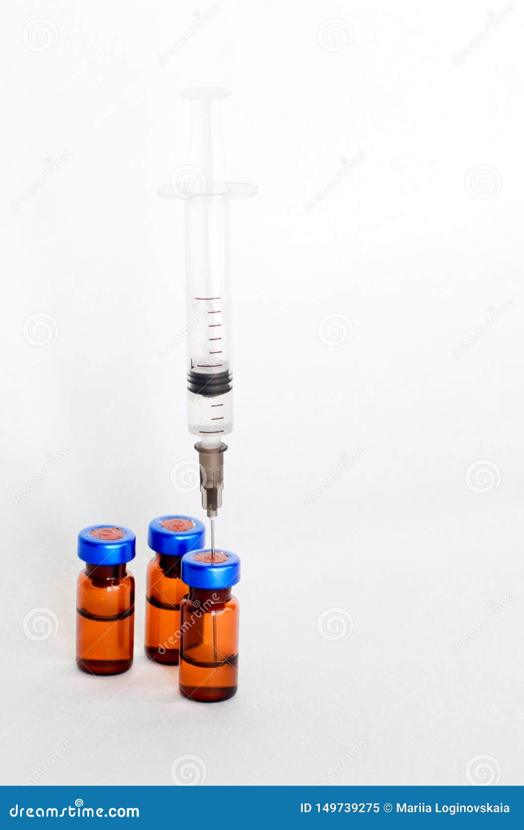 Medical Vials, Ampules for Injection with a Syringe on a White