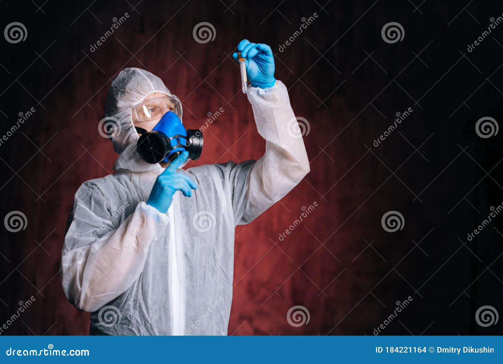 Medical Worker in Protective Suit, Goggles and Respirator Holds Test ...