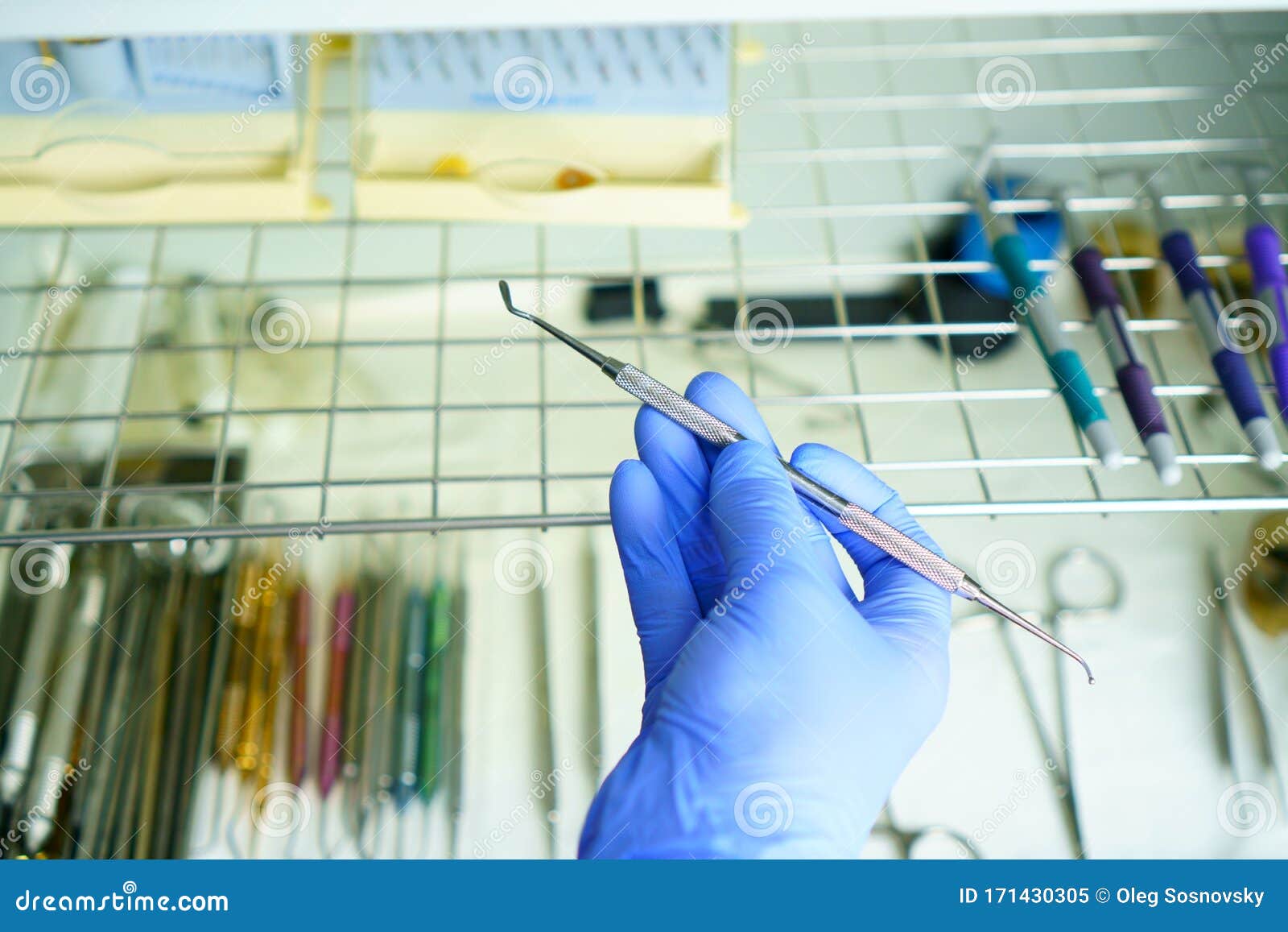 a medical worker puts a medical instrument in a device for disinfection and cleaning of germs. stylishness and cleanliness in