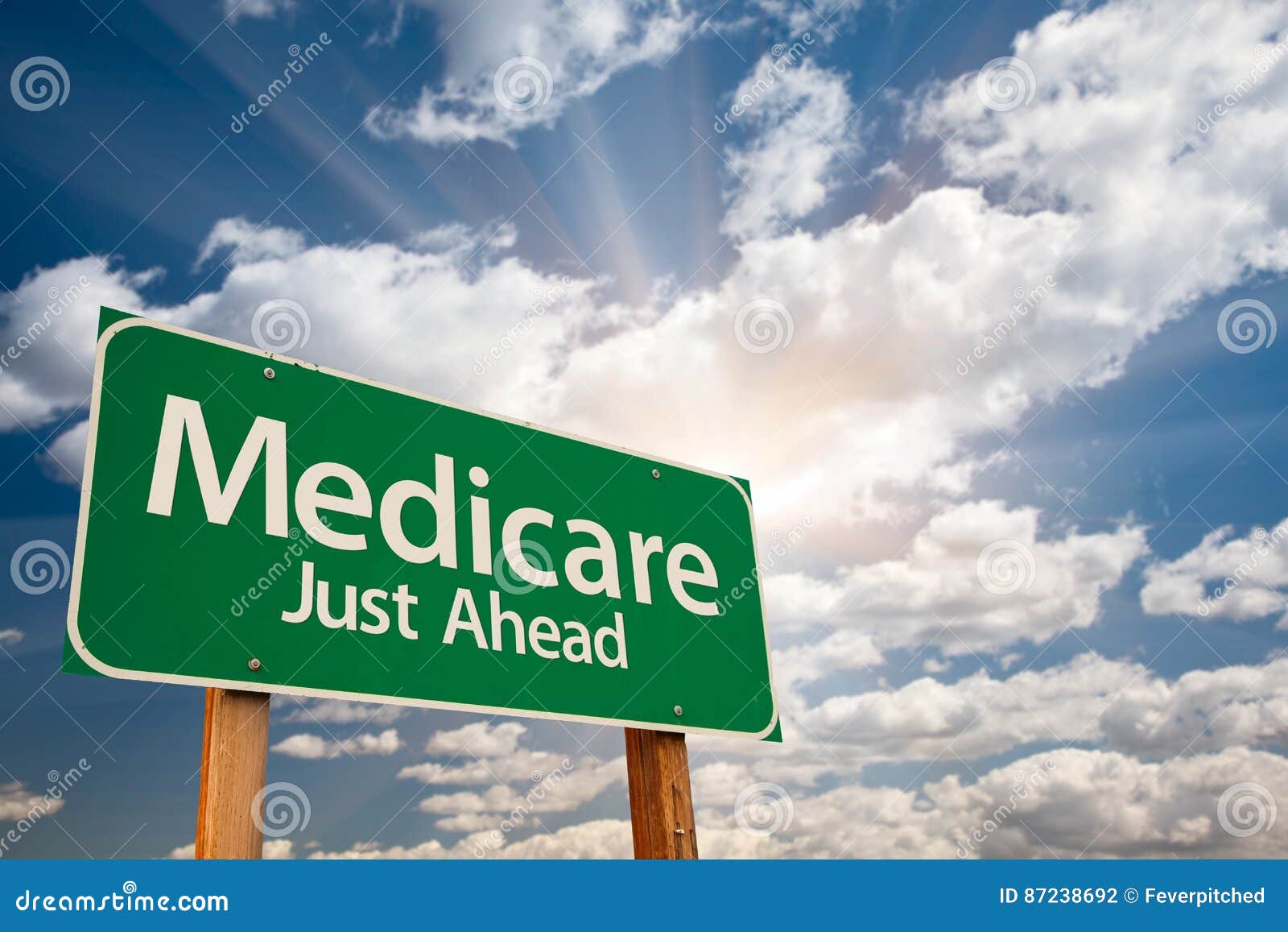 medicare green road sign over clouds
