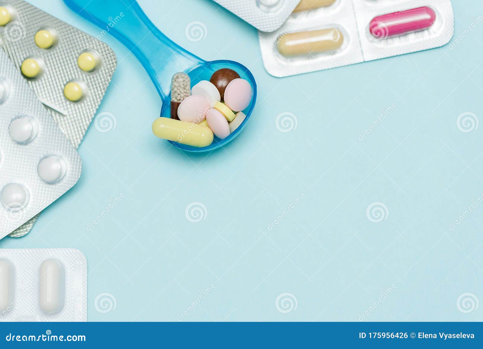 medicine pills on on blue backdrop. copy space