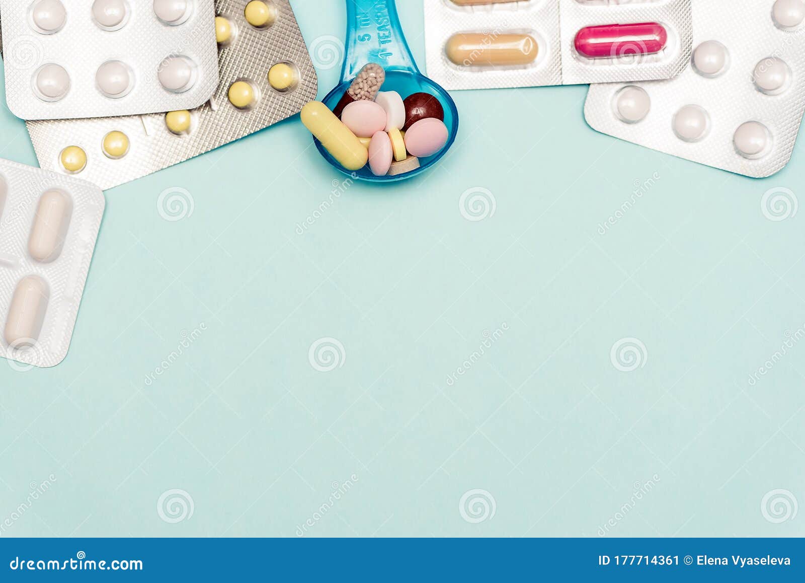 medicine pills on on blue backdrop. copy space