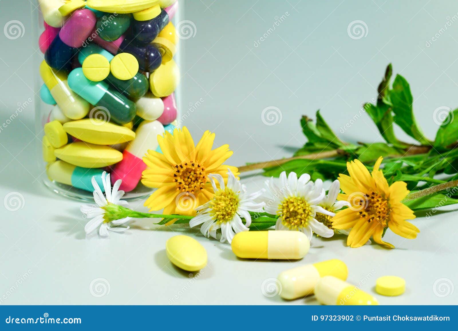 Medicine Pills with Yellow and White Flower. Stock Photo Image of