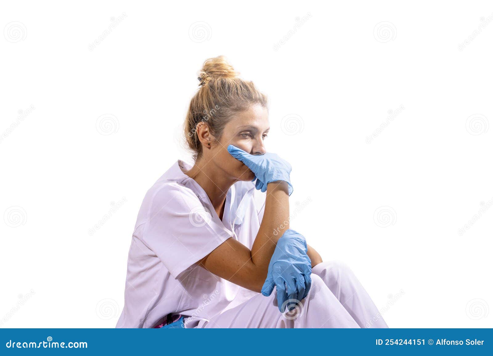 medico girl defeated after a long day at the hospital. white background