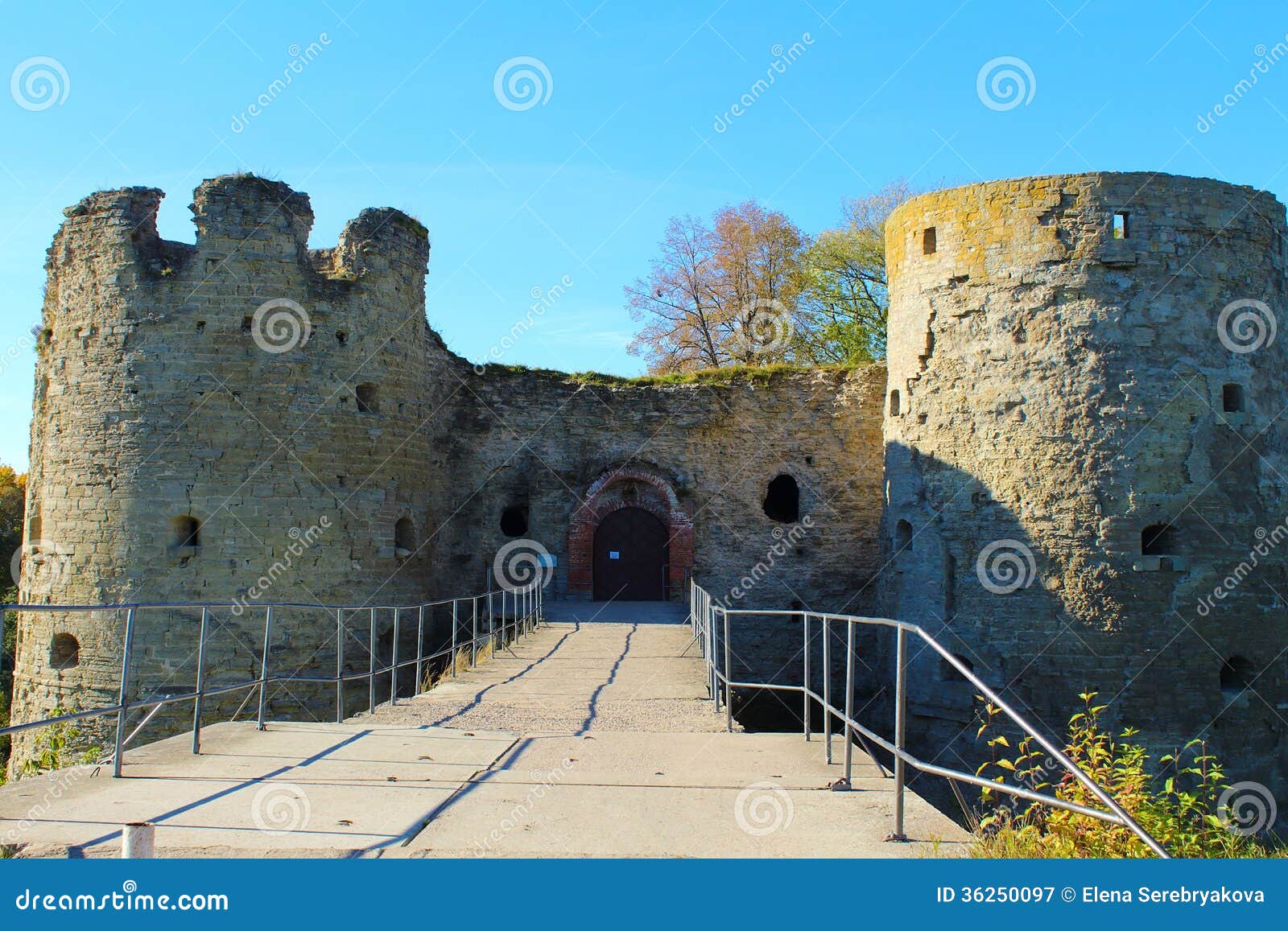 a medieval fortress, entrance and towers.