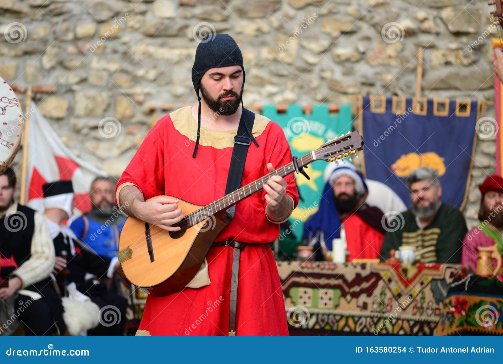 Medieval guitar minstrel editorial stock image. Image of military