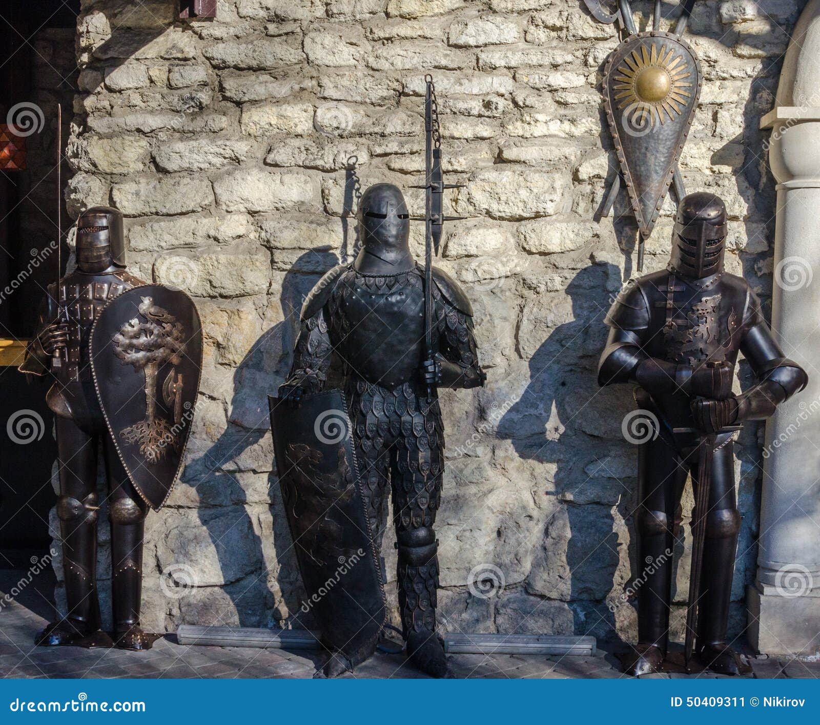 Medieval Knights in Armor Against the Wall of the Castle Stock Image ...