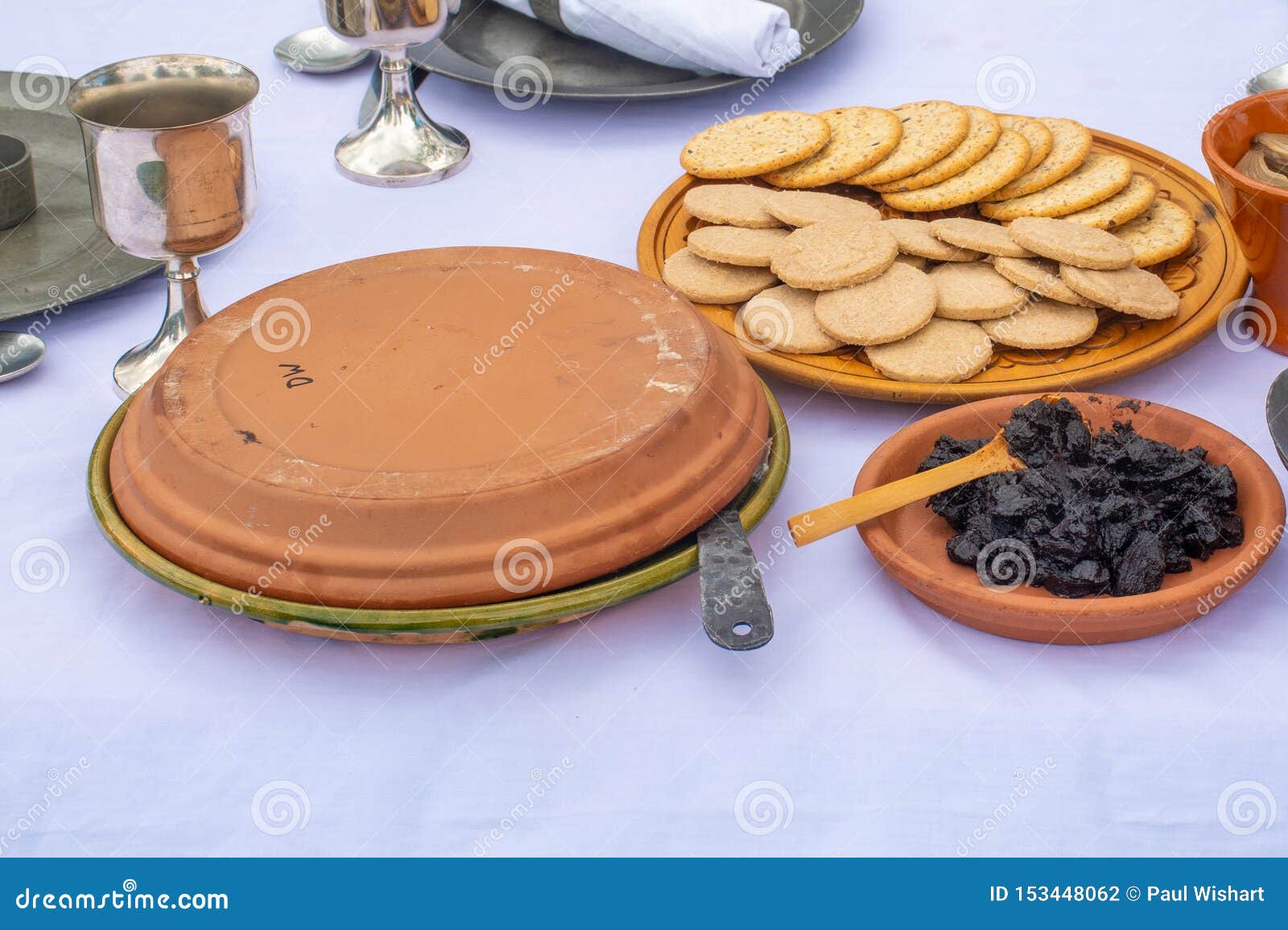 Medieval Plate of Food on Table of Biscuits and Fruit Stock Photo