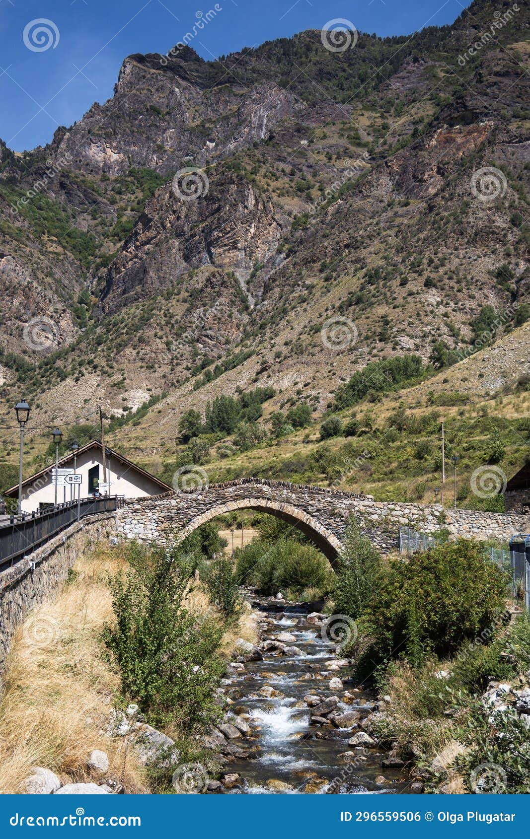 medieval stone bridge over the river in espot village in pyrenees mountains