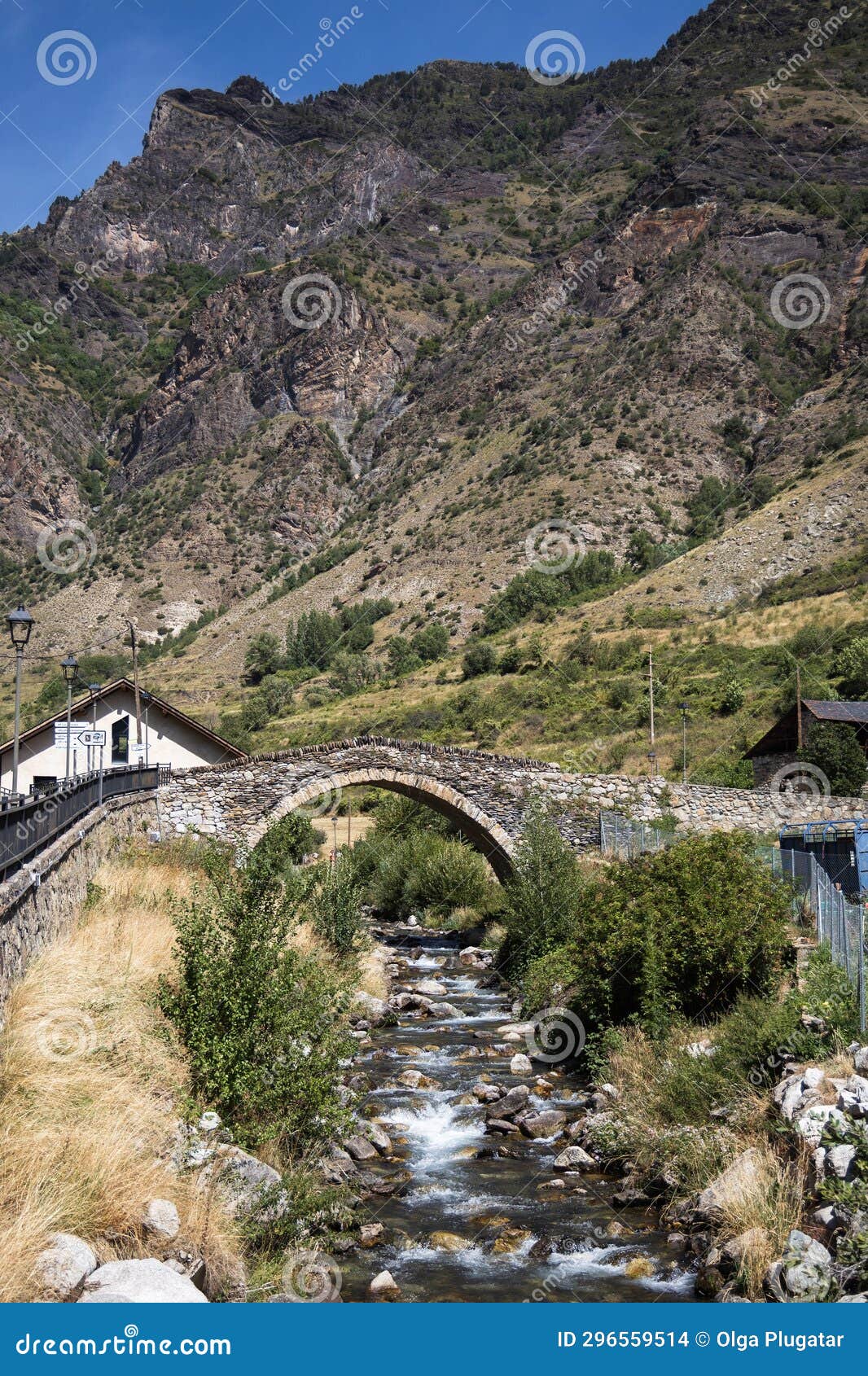 medieval stone bridge over the river in espot village in pyrenees mountains