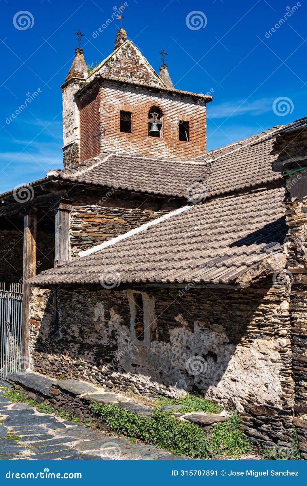 medieval stone church in an old black village in guadalajara, majaelrayo.