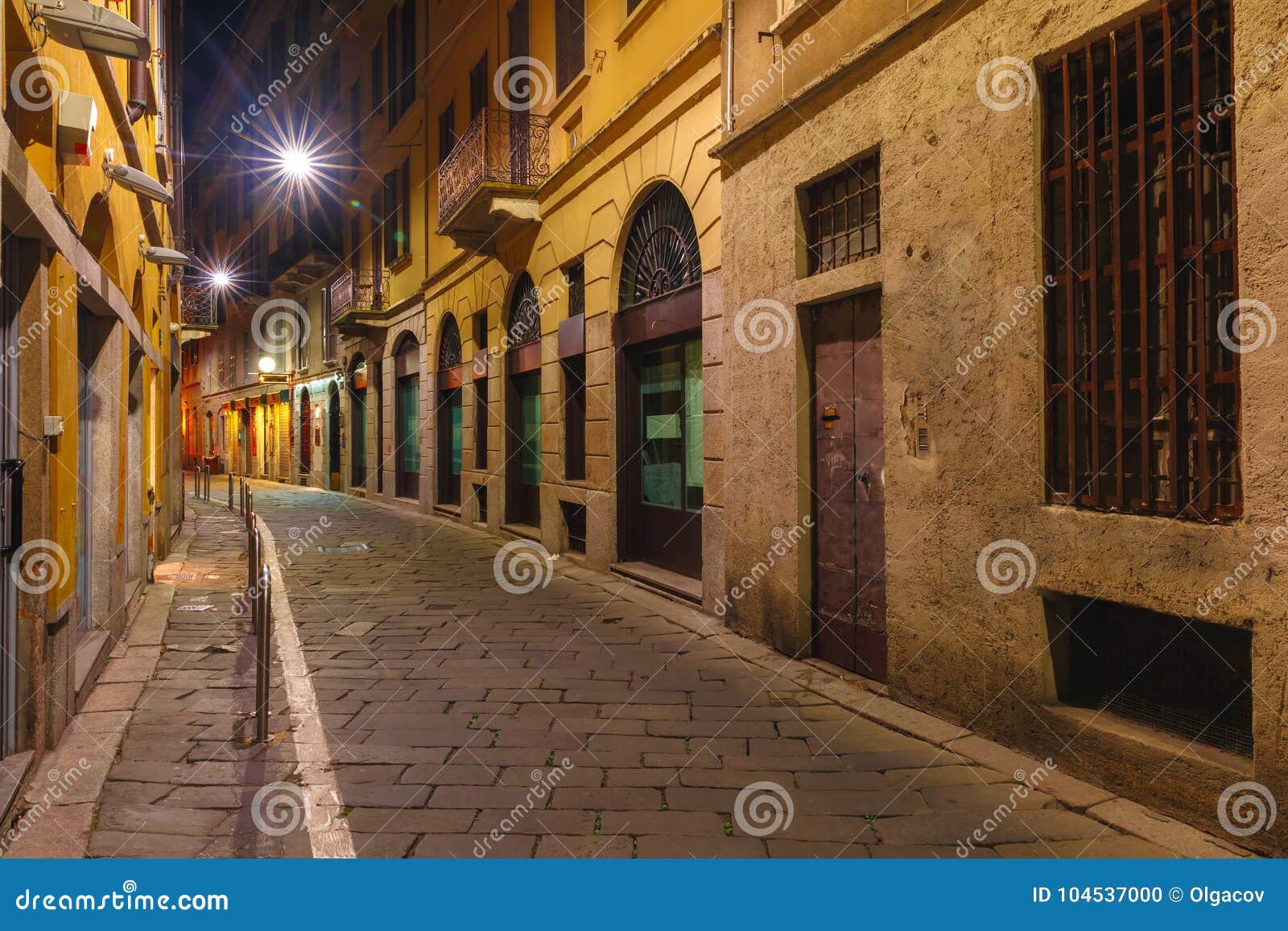 medieval street at night in milan, lombardia, italy