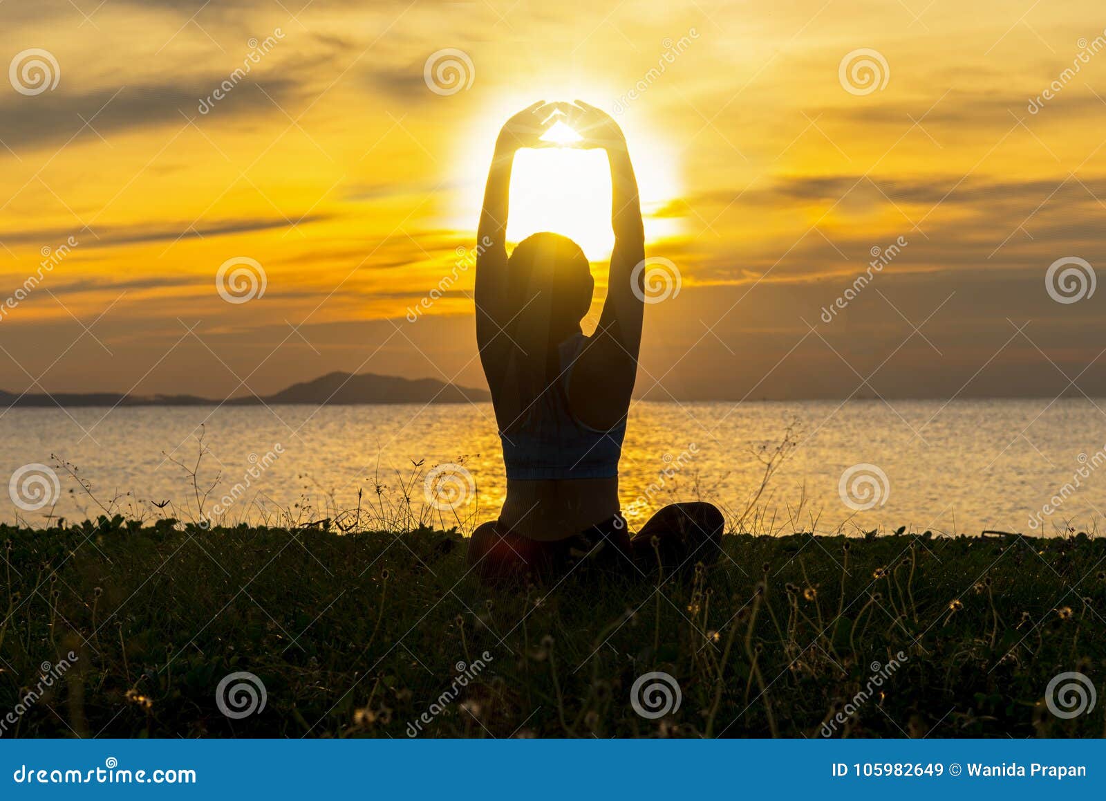 meditation yoga lifestyle woman silhouette on the sea sunset, relax vital.