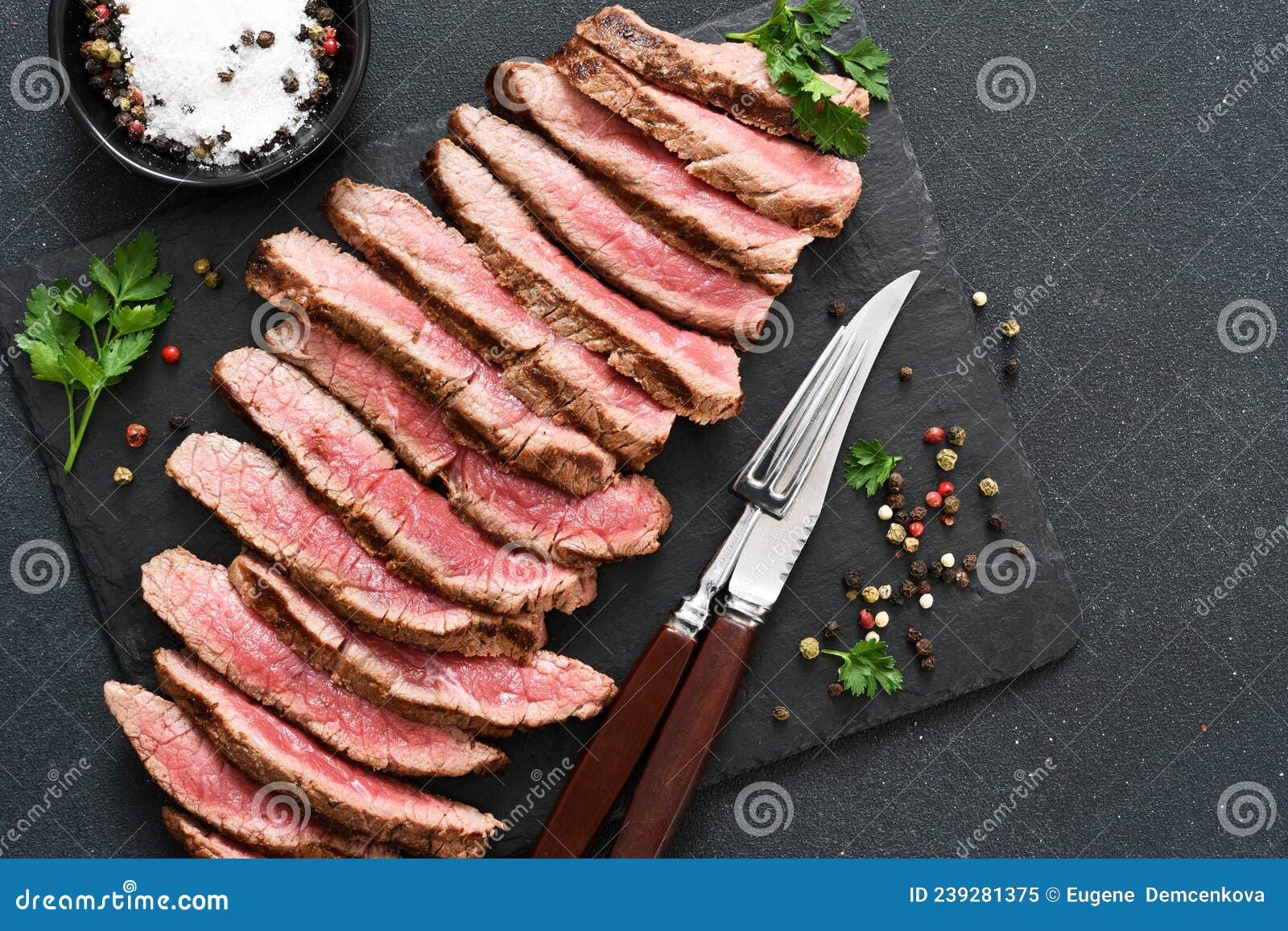 medium meat. grilled steak with provencal herbs on a stone board