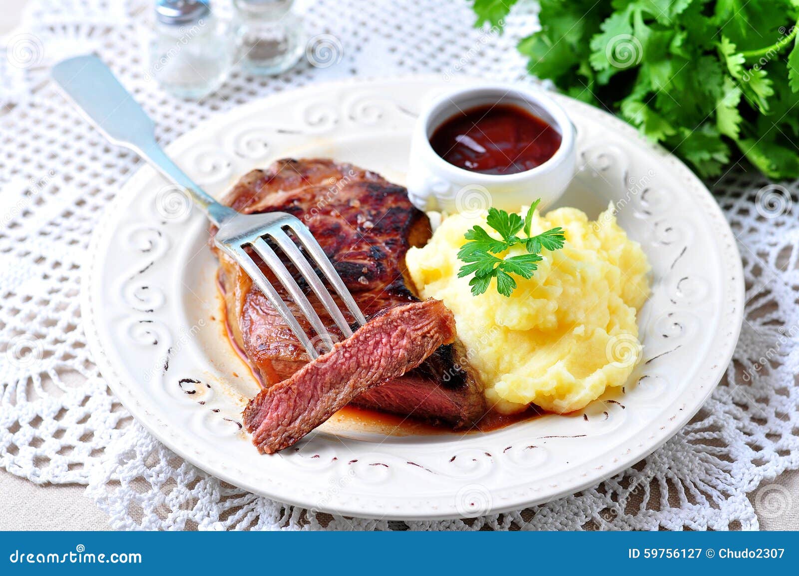 Medium Rare Grilled Beef Steak with Mashed Potatoes and Barbecue Sauce